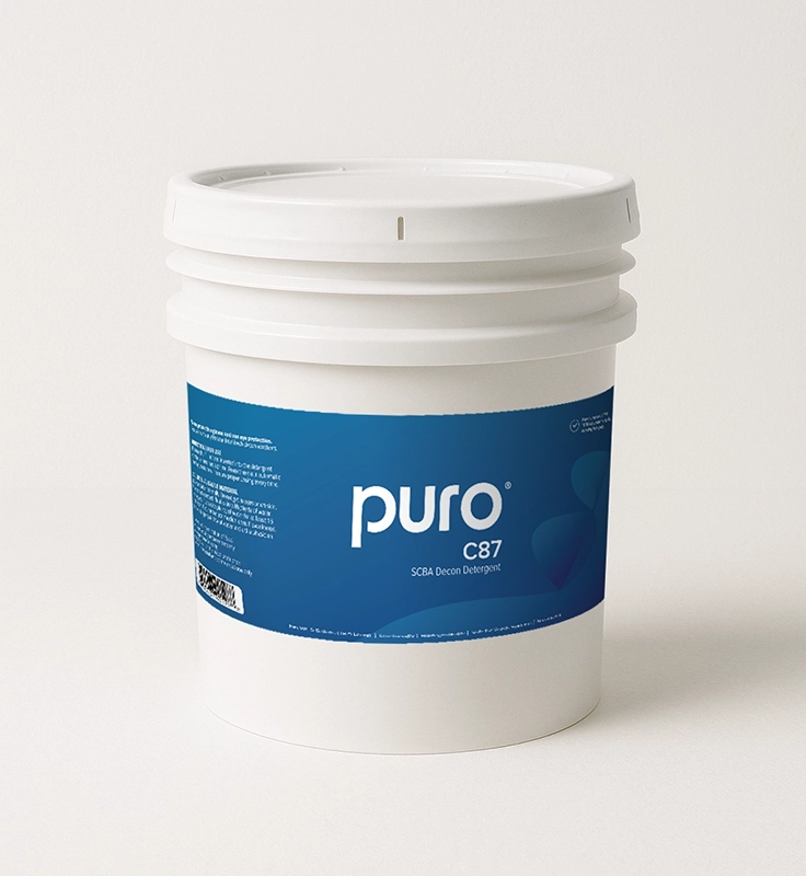 A white bucket labeled ”puro C87 SCBA Decon Detergent” with a blue label.